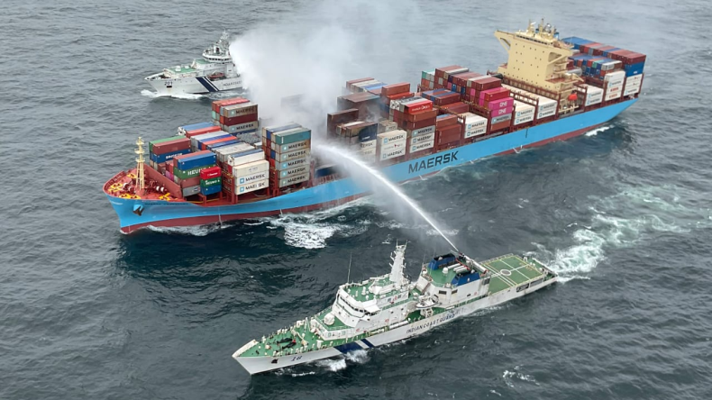 Maersk Frankfurt containership on fire with two firefighting vessels alongside