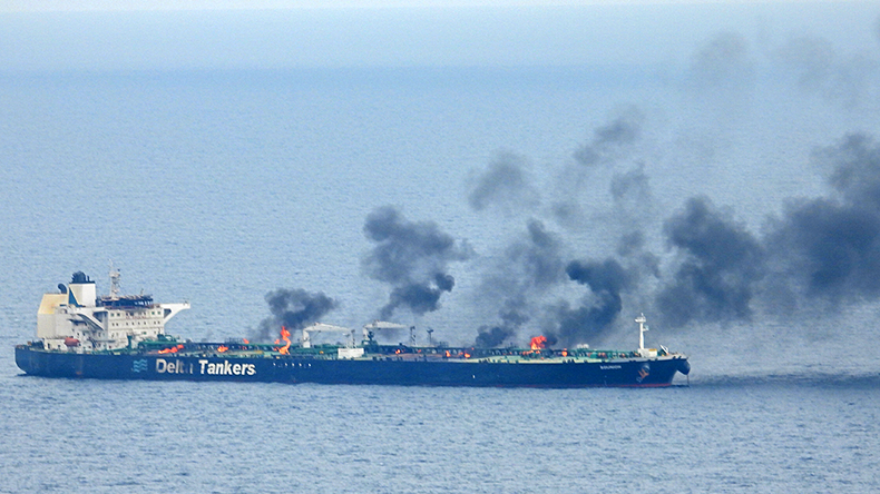 Tanker hatches on fire with black smoke