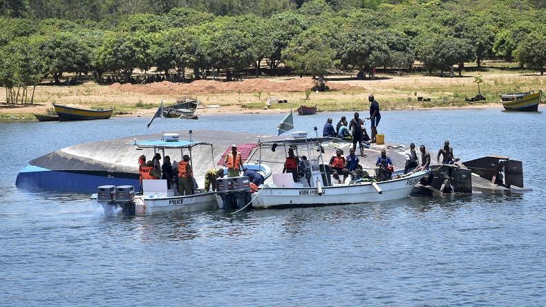Rescue divers work alongside the capsized MV Nyerere passenger ferry on Ukara Island, Tanzania Saturday, Sept. 22, 2018. The death toll soared past 200 on Saturday while officials said a survivor was found inside the capsized ferry and search efforts were ending to focus on identifying bodies, two days after the Lake Victoria disaster. (AP Photo)