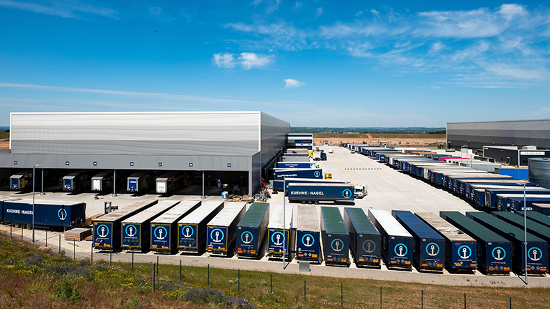 Empty Kuehne+Nagel trailers at a large regional distribution centre