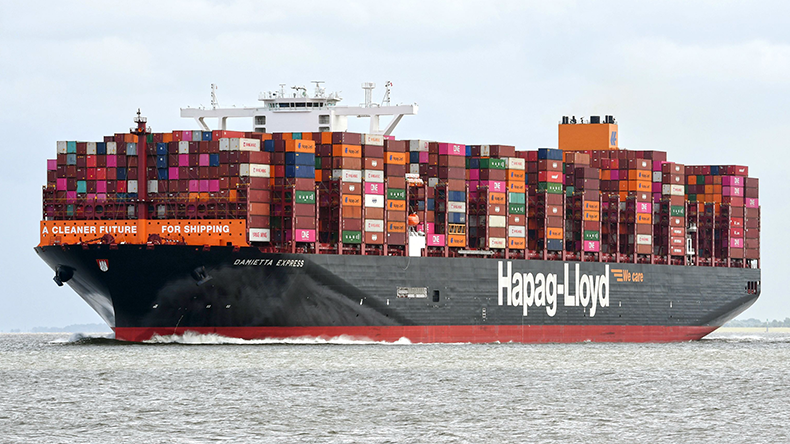 Containership at sea loaded with boxes