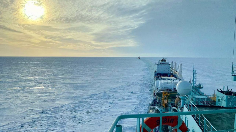 Containership moves through ice in the Arctic