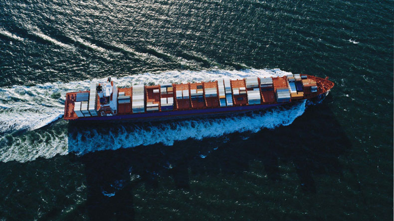 Aerial view of boxship at sea