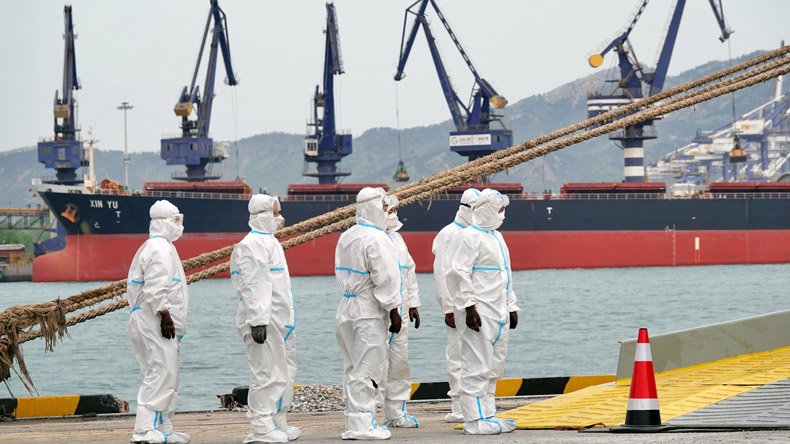 Chinese dock workers in Yantai. Picture: Sipa US / Alamy Stock Photo