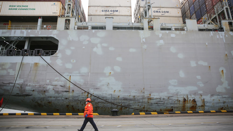 Qingdao dock worker in anti-coronavirus mask