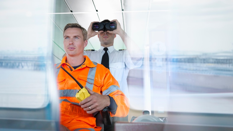 Seafarers on bridge of ship