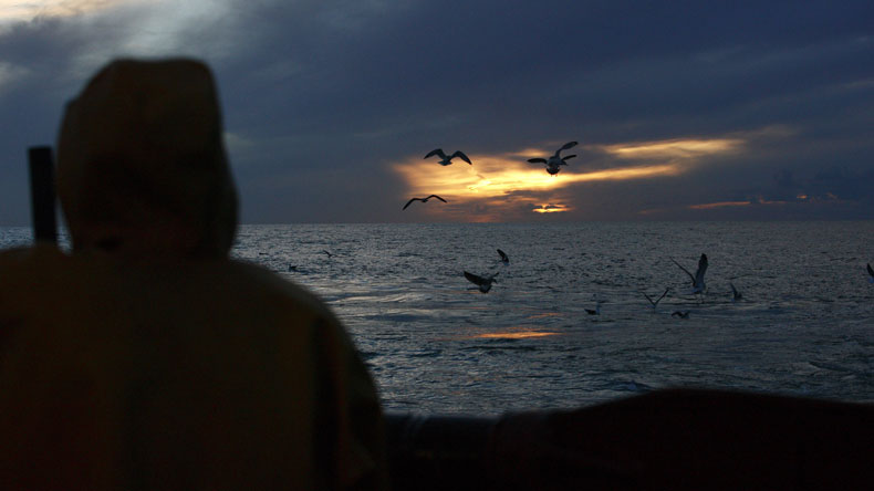 Crew member at sunset