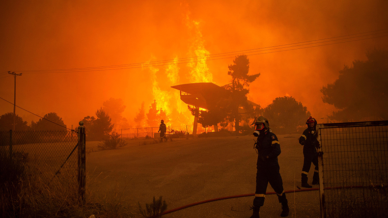 Greece. 05th Aug, 2021. Firefighters battle a forest fire approaching a gas station in a wooded area north of Athens. A massive forest fire is raging again in northern Athens Credit: dpa picture alliance / Alamy Stock Photo
