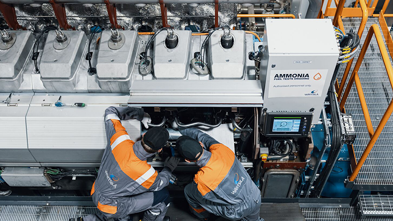 Two engineers working on an ammonia engine