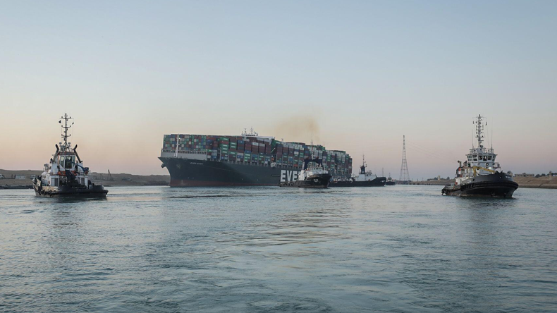 Tugs positioning Ever Given. Credit dpa picture alliance/Alamy Live News -