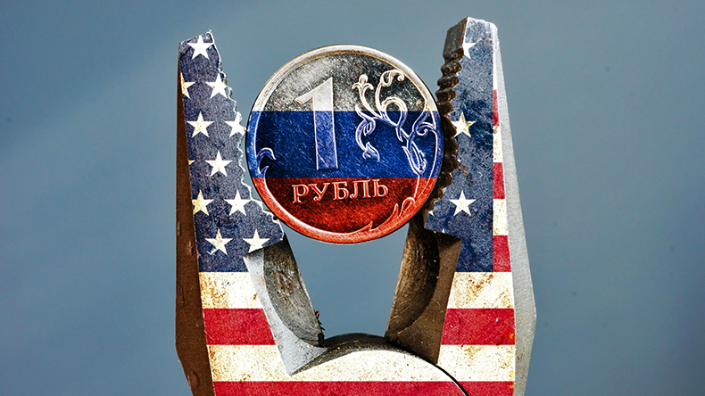 Pliers with USA flag squeezed the ruble with Russian flag