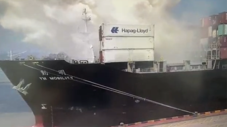 Smoke coming from containership on YM Mobility at port