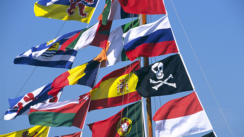 Flags on a boats entering Amsterdam harbor during the SAIL 2005 maritime event