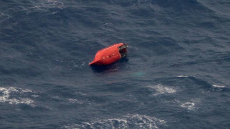 This photo provided by the 11th Regional Coast Guard Headquarters shows a damaged lifeboat, which is believed to be of the Emerald Star near its sinking site, off the Philippines' eastern coast Friday, Oct. 13, 2017. Japan's coast guard says the Hong Kong-registered freighter sank in rough seas off the Philippine coast, leaving 11 crewmembers missing. (The 11th Regional Coast Guard Headquarters via AP)