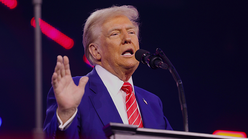 Donald Trump addresses attendees at the 2024 AmericaFest, Phoenix, Arizona