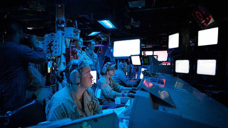 Sailors aboard the guided-missile destroyer USS Carney