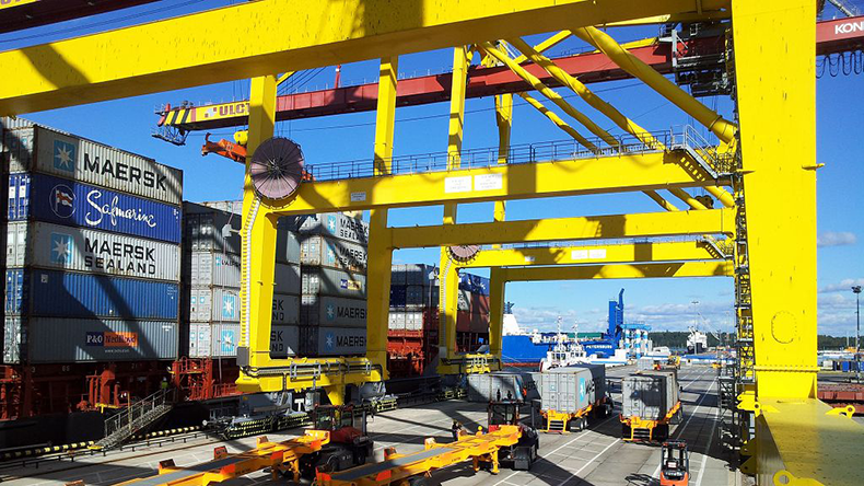 Cranes loading boxes at Ust-Luga Container Terminal in Russia