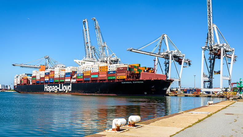 Guayaquil Express containership operated by Hapag-Lloyd shipping company is being loaded by gantry cranes at Le Havre, France