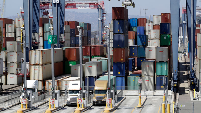 Unloading trucks at Long Beach 2018 AP photo