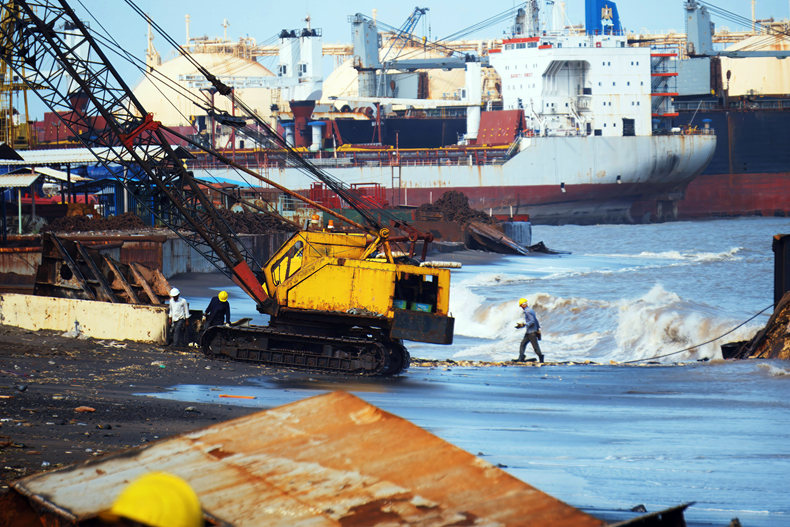 Yellow crane positioned at Alang’s shipbreaking yard