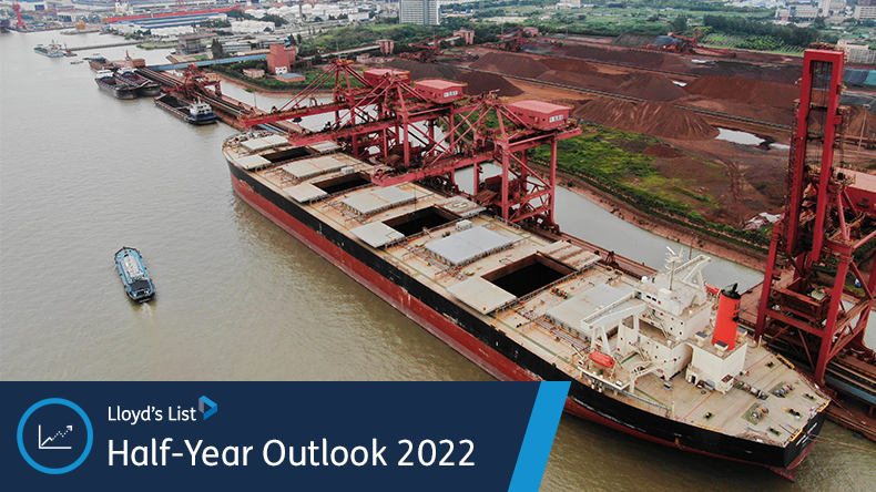 A cargo ship carrying imported iron ore berths on a quay at the Port of Nantong city, east China's Jiangsu province