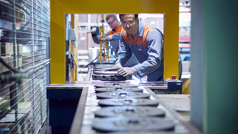 Workers on production line in a clutch factory