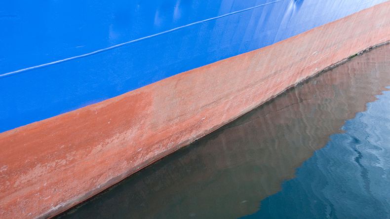 Ship hull water line painted with antifoul paint to prevent biofouling