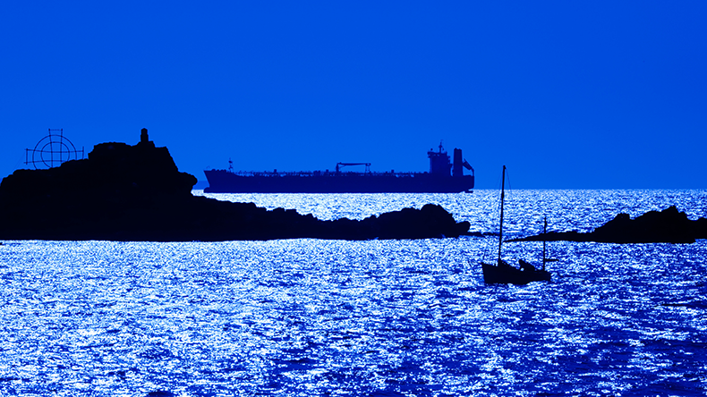 A crude oil tanker waits offshore