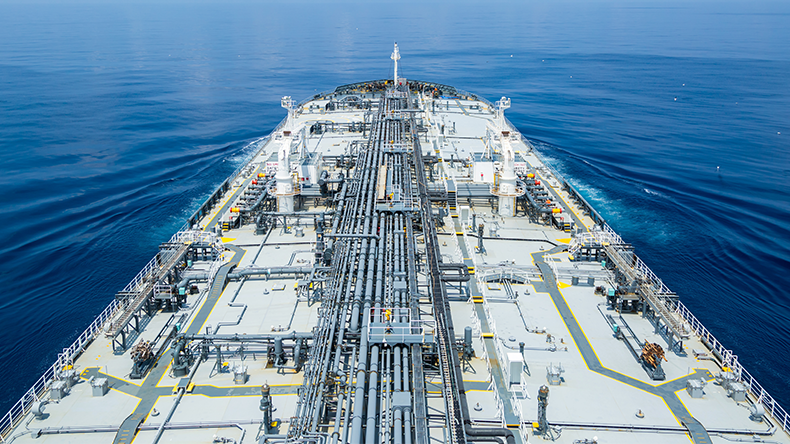 Grey oil tanker in calm blue ocean