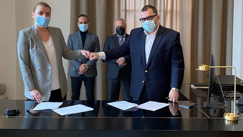 Despina Panayiotou Theodossiou (left) and SRH Marine owner and executive chairman John Laderos after signing their MAR360 joint venture deal, watched by Tototheo owner Socrates Theodossiou (centre left) and Theodoros Nikolopoulos.