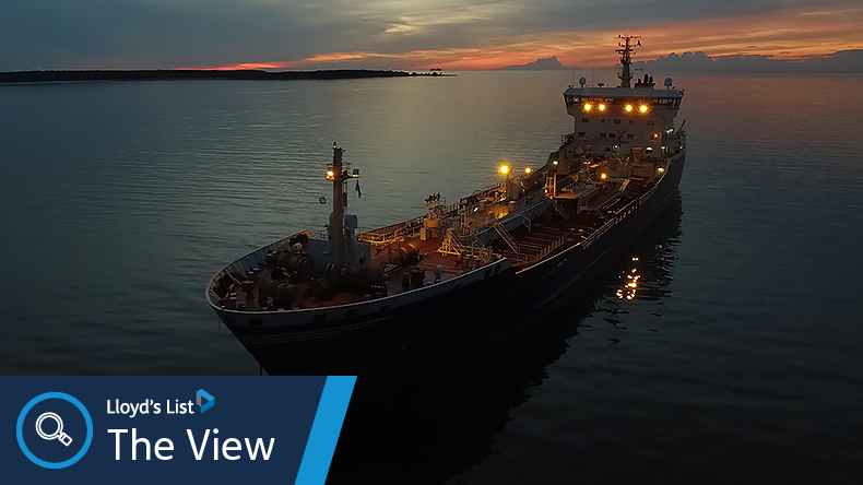 Product tanker at sea at night with lights on