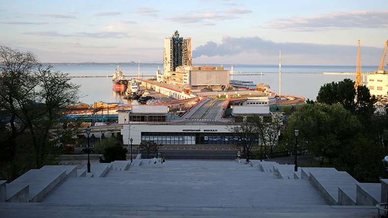 View from the Potemkin Stairs to the Sea Port Building in Odesa, Ukraine in 2024 and the smoke above it after the Russian missile attack