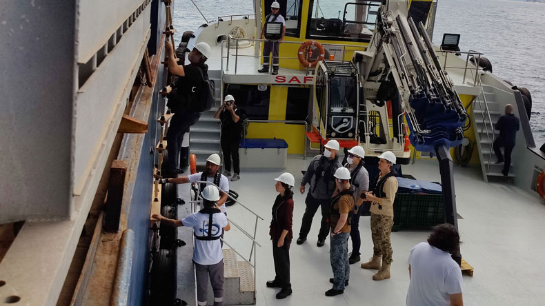 Members of the joint inspection team boarding Razoni